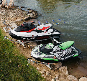 two personal watercraft ramps on lakeside