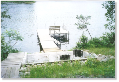sectional dock in the summer with a bench
